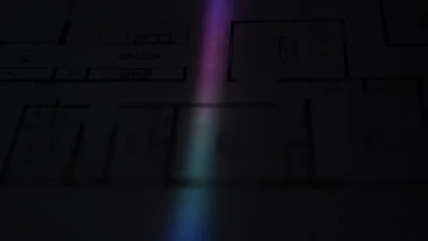 Low light slow motion scanner light on paper house plan Stock Footage 122012296