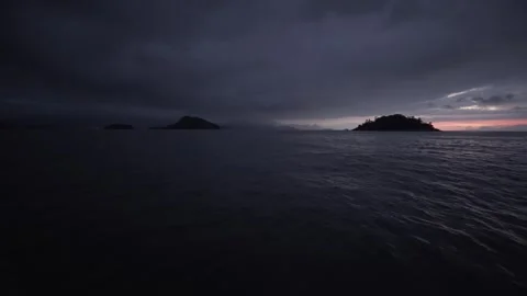 Low Light Sunrise Over the Atlantic Ocean with Islands Near Ilha do Araújo Stock Footage 320634945