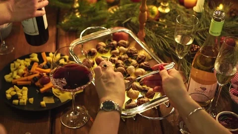 Low light. View from above. women's hands pull the cooked snail out of the shell Stock Footage 146178742