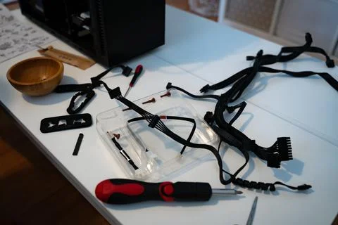 Low living room table with PC repair tools, screwdrivers and cables Stock Photos