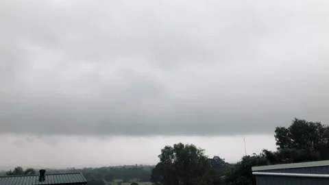 Low lying cloud with roof top of sheds Stock Footage 162997216