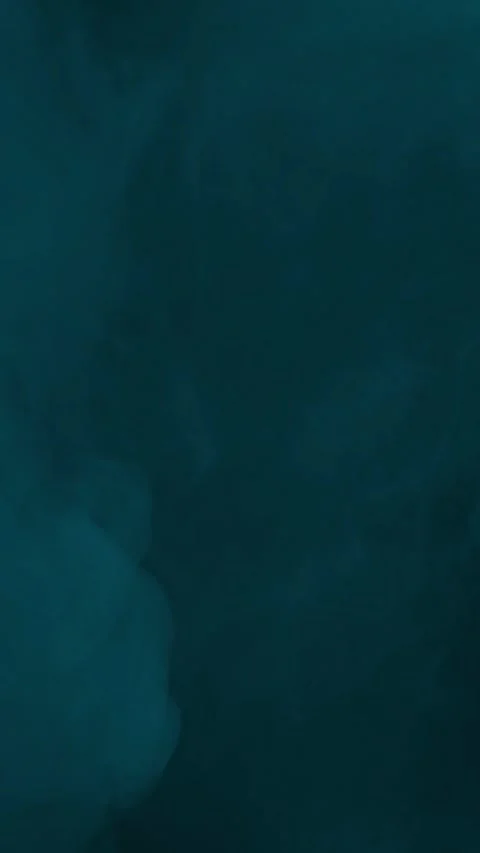 Low lying cyan ground fog or mist on black background, vertical format Stock Footage 340145071