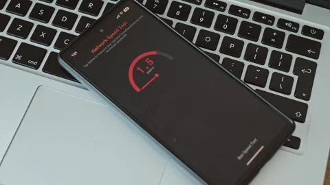 Low mobile internet speed test. Smartphone showing Stock Footage 337998425