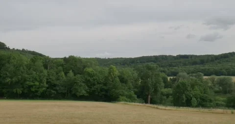 Low mountain range Elm location Reitlingstal with valley, fields, forest hills Video stock 313033970