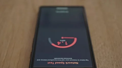 Low network bandwidth connection speed test on mobile phone screen Stock Footage 337998433