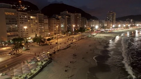 Low night aerial tracking back along Copacabana beach, Rio de Janeiro, Brazil 스톡 동영상 101287469