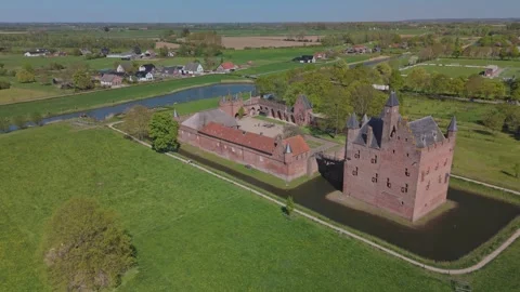 Low orbit of Doornenburg Castle in Dutch countryside Stock Footage 334319255