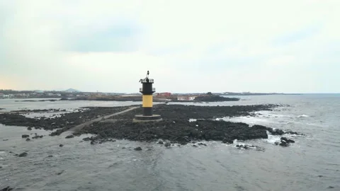 Low Orbiting View of Udo Island around a Lighthouse, Udo-biyangdo. Stock Footage 146067145