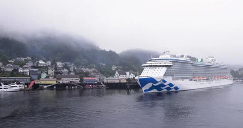 Low overcast rain clouds at Ketchikan approach a docked cruise ship Stock Footage 209966960