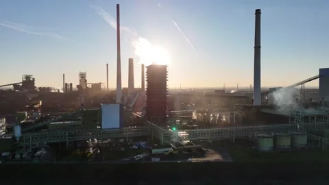 Low parallel drift past smoke filled industrial complex Stock Footage 331203092