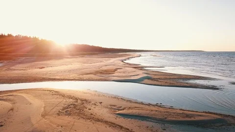 Low pass above sandy beach on sunset Stock Footage 90758164