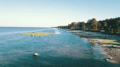 A low-pass above shallow bay waters Stock Footage 146701780