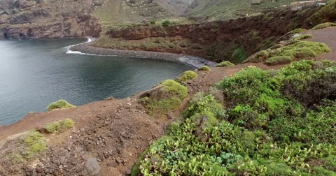 Low pass flight over cliff Stock Footage 58214557