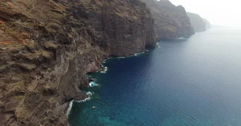 Low pass flight over cliff Stock Footage 58217326