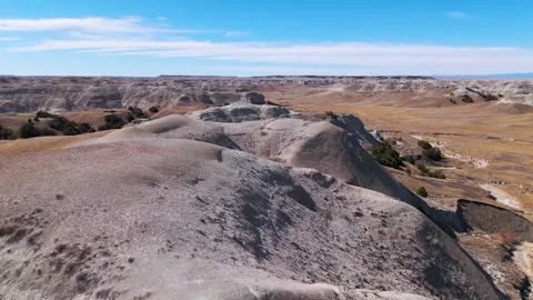 Low pass over badland bluff Stock Footage 306092714