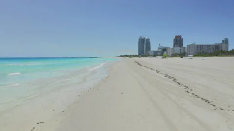 Low pass over empty Miami Beach shoreline 動画素材 130331023