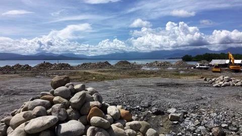Low Pass Over Rubble on Reclaimed Coastal Shore Puerto Princesa Video stock 332989477