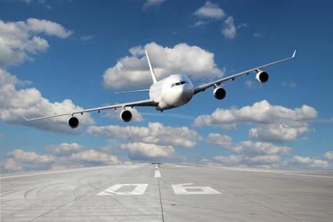 Low pass of white plane 스톡 사진