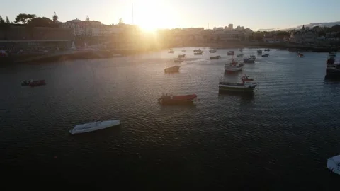Low perspective Point of View close to fishing boats at sunset in Cascais Bay Stock Footage 245242409
