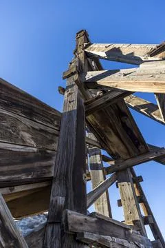 Low point of view looking up at an old mining headframe Stock Photos