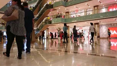 Low point of view POV shot showing shoppers, train ride, branded outlets and Video stock 113907899