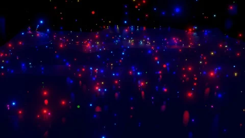 Low poly surface onto which luminous multi-colored balls fall. 4k abstract dark Stock Footage 127813767
