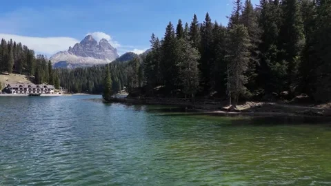 Low Proximity Water Glide Advancing to Reveal Snowy Dolomite Massif hori 스톡 동영상 340307839