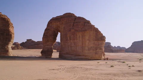 Low pull out aerial view of Elephant Rock, Al Ula, Saudi Arabia, 4K. Stock Footage 196810964