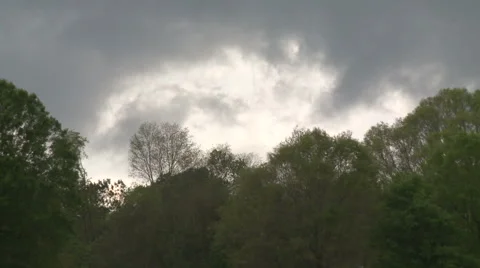 Low, Ragged Storm Clouds above Alabama Forest Stock Footage 54714118