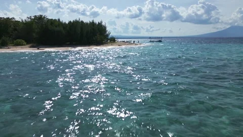 Low rapid aerial approach of Tabuhan Island, East Java Stock Footage 340157838