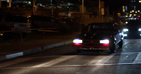 Low Rider Buick Driving Down Street at Night (Low Light) Stock Footage 211897821