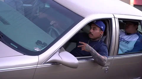Low rider passes down busy street Stock Footage 251845983