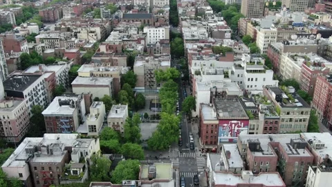 Low-rise SoHo roofscape meets leafy streets and modern apartments Stock-Footage 131280251