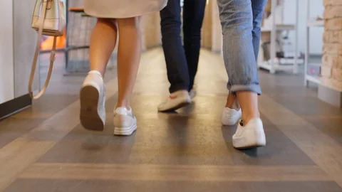 Low Section of Legs of Colleagues Walking and Riding Scooter in Office Stock Footage 126132429