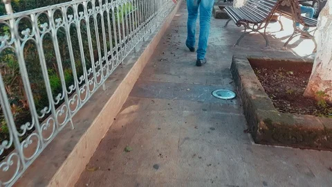 Low section of a man walking on a passage outdoor Stock Footage 98631870