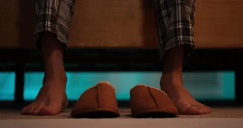 Low section of man wearing slippers Stock Footage 145289713