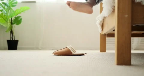 Low section of man wearing slippers and walking Stock Footage 156469184