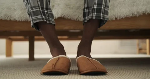 Low section of man wearing slippers Video stock 156519519