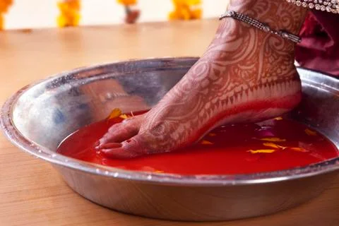 Low section view of a bride performing marriage rituals Stock Photos
