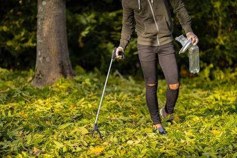 Low section of volunteer conserving environment from pollution and plastic Stock Photos