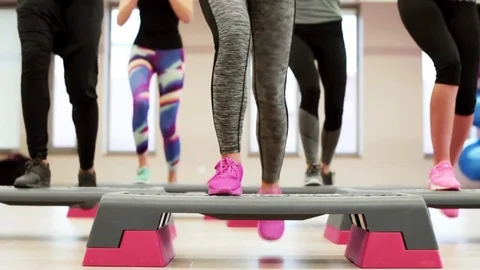 Low section of women doing stepping exercise Stock-Footage 75779377