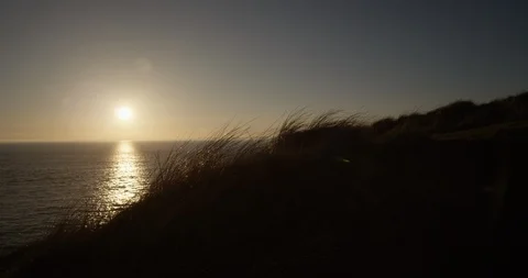 Low Setting Sun Over Sea Water Stock Footage 127915437