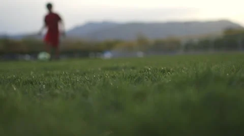 Low shot of boy playing soccer 動画素材 37408339