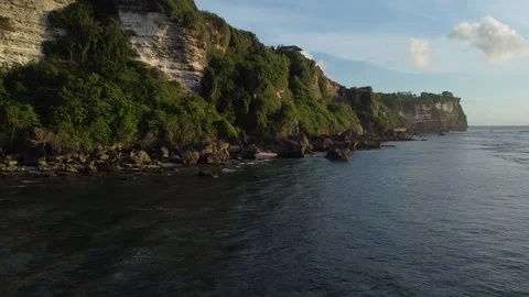 LOW SHOT OF CLIFFS MOVING TOWARDS POINT Stock Footage 221300211