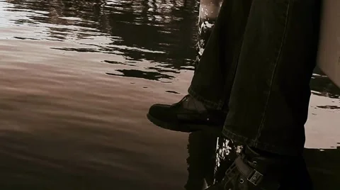 Low shot man sitting on dock over water Stock-Footage 45290020