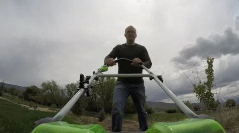Low shot of mowing the lawn Stock Footage 49878871