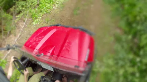 A low shot of a side by side four wheeler traveling on dirt road Stock Footage 25242043