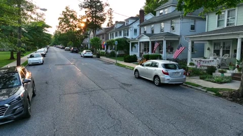 Low shot of small town American street. Suburb with family homes. American Video stock 201587091