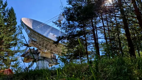 Low slider shot of massive dish of ex-Soviet RT-32 radio telescope for Stock Footage 282185620