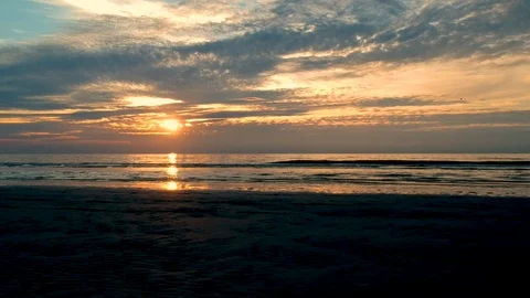 Low steady shot over beach out over water Stock Footage 122449538